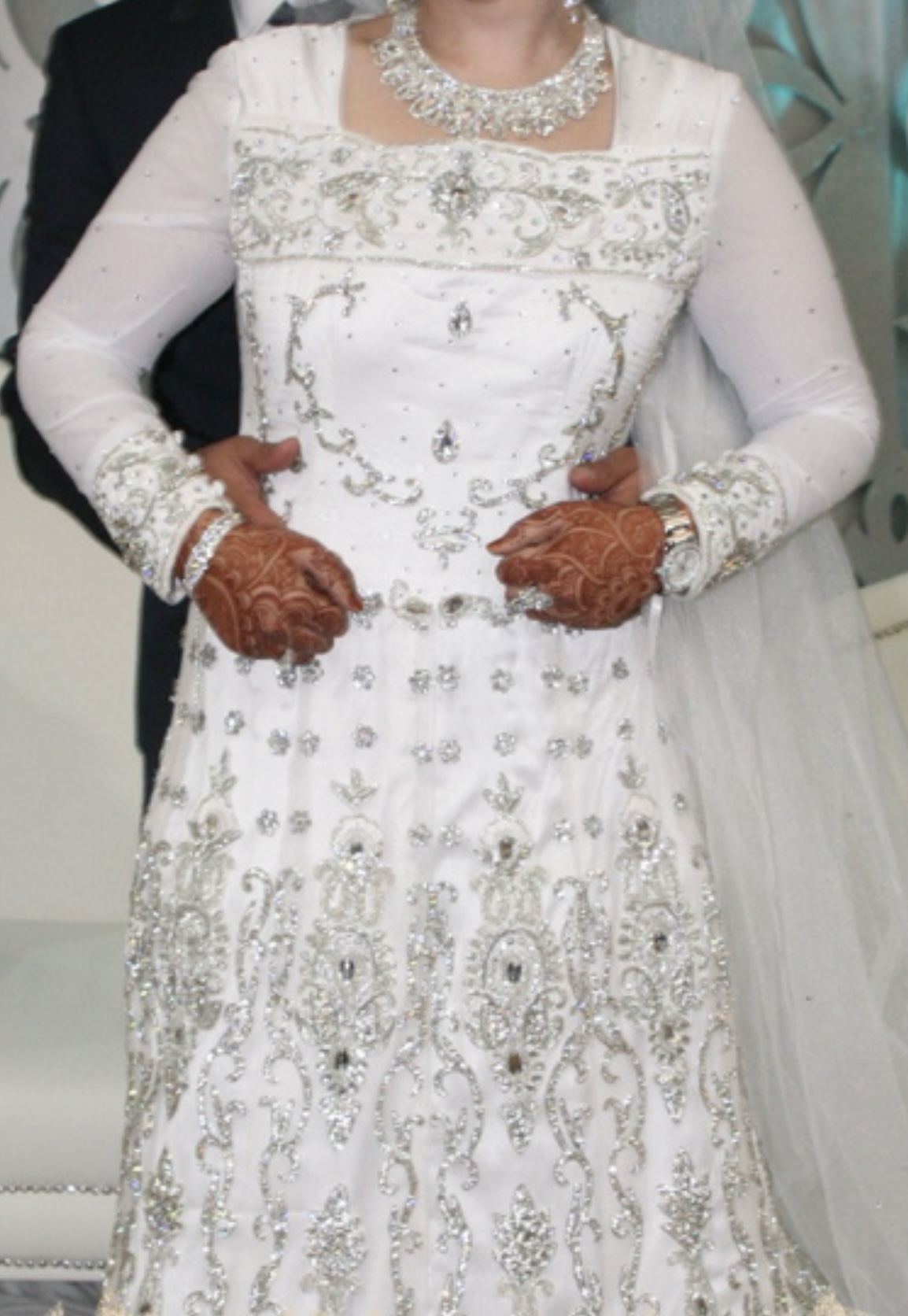 Elegant long sleeve white diamanté wedding gown