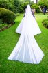 Elegant white wedding dress. Vile and crown